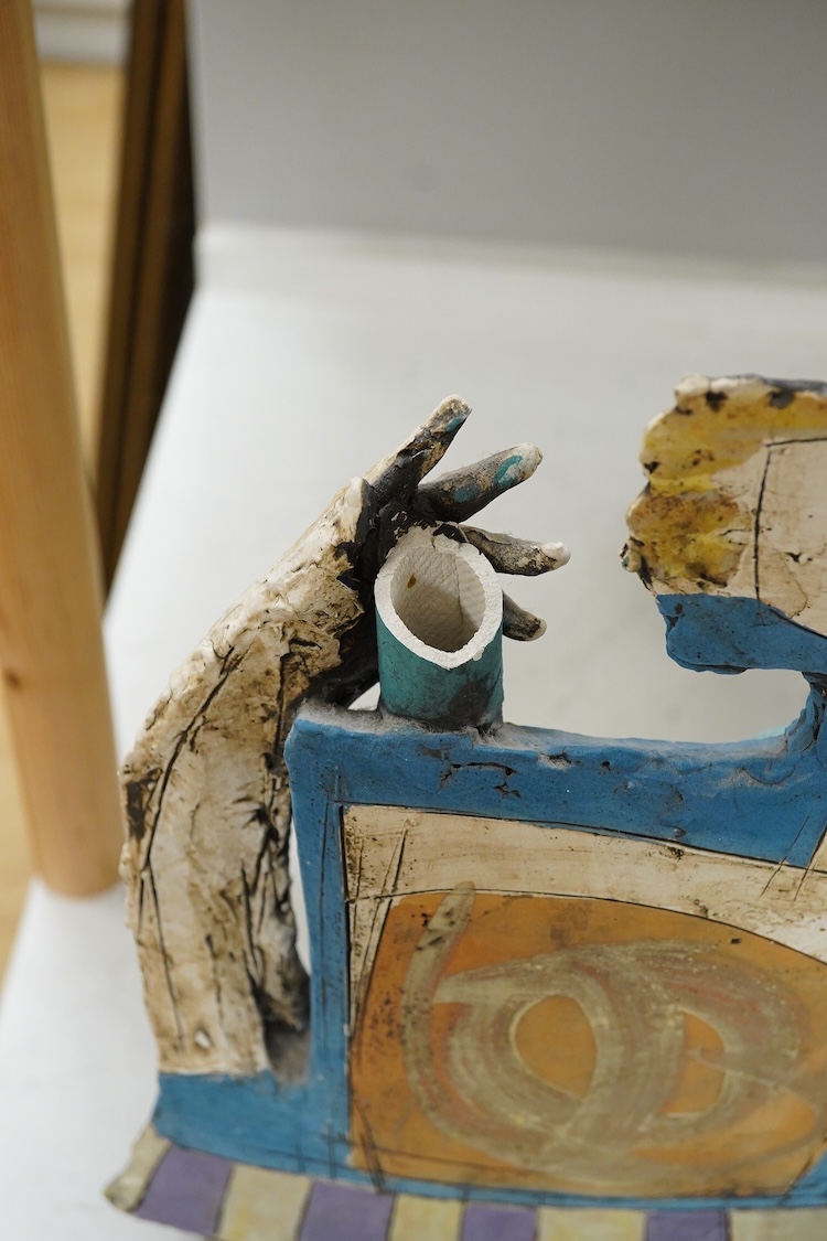 Christy Keeney (b.1958) abstract ceramic study of a figure playing an instrument, signed, 42cm high (damaged)